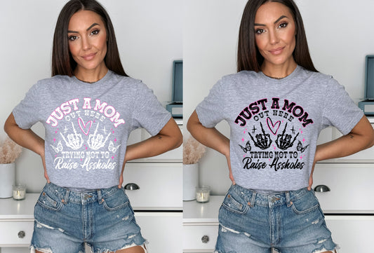 DTF JUST A MOM TRYING NOT TO RAISE AHOLES (2 COLORS AVAIL.) TRANSFER